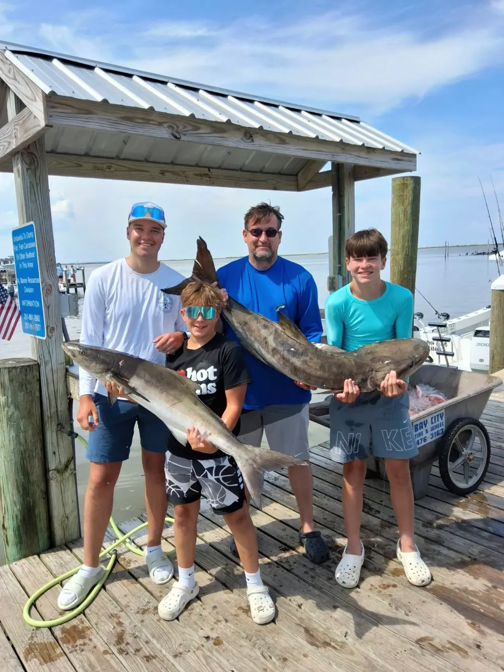 Beginners enjoying a fishing charter in Gulfport, learning and having fun on the water